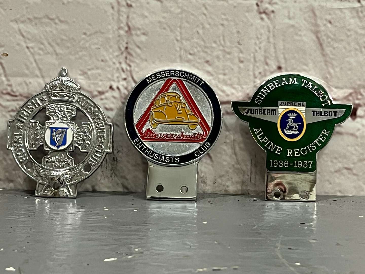 <p>Three Classic Car Badges&nbsp;</p>