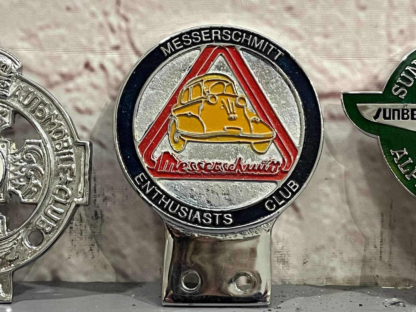 <p>Three Classic Car Badges&nbsp;</p>