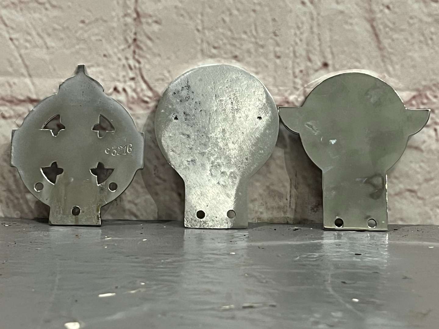 <p>Three Classic Car Badges&nbsp;</p>