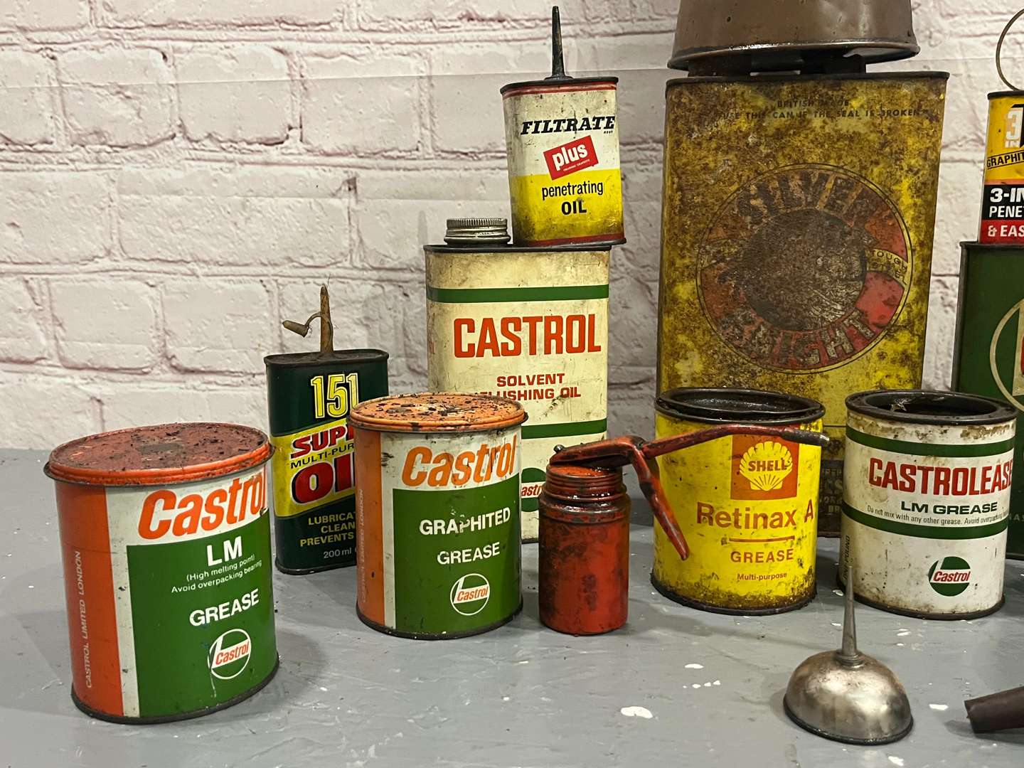 <p>Quantity of Castrol, Shell Grease and Oil Cans</p>