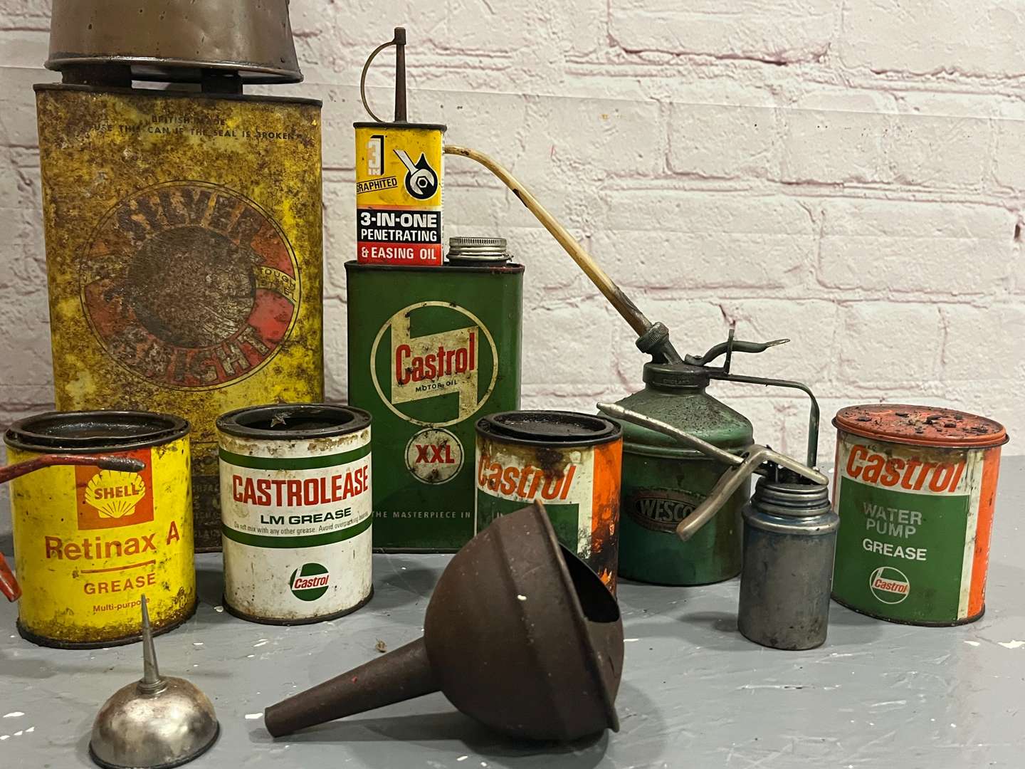 <p>Quantity of Castrol, Shell Grease and Oil Cans</p>