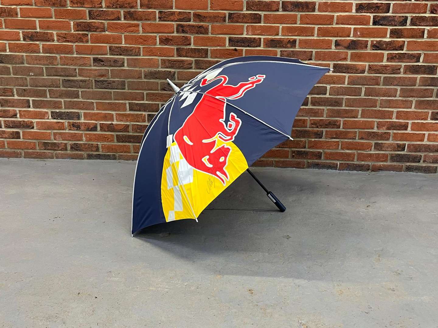 <p>Red Bull Umbrella Signed By Sebastian Vettel & Mark Webber (With COA)</p>