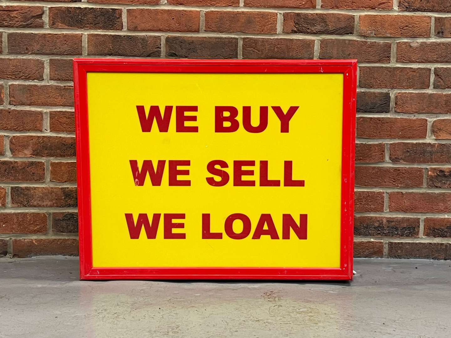 <p>We Buy, We Sell, We Loan Illuminated Sign</p>
