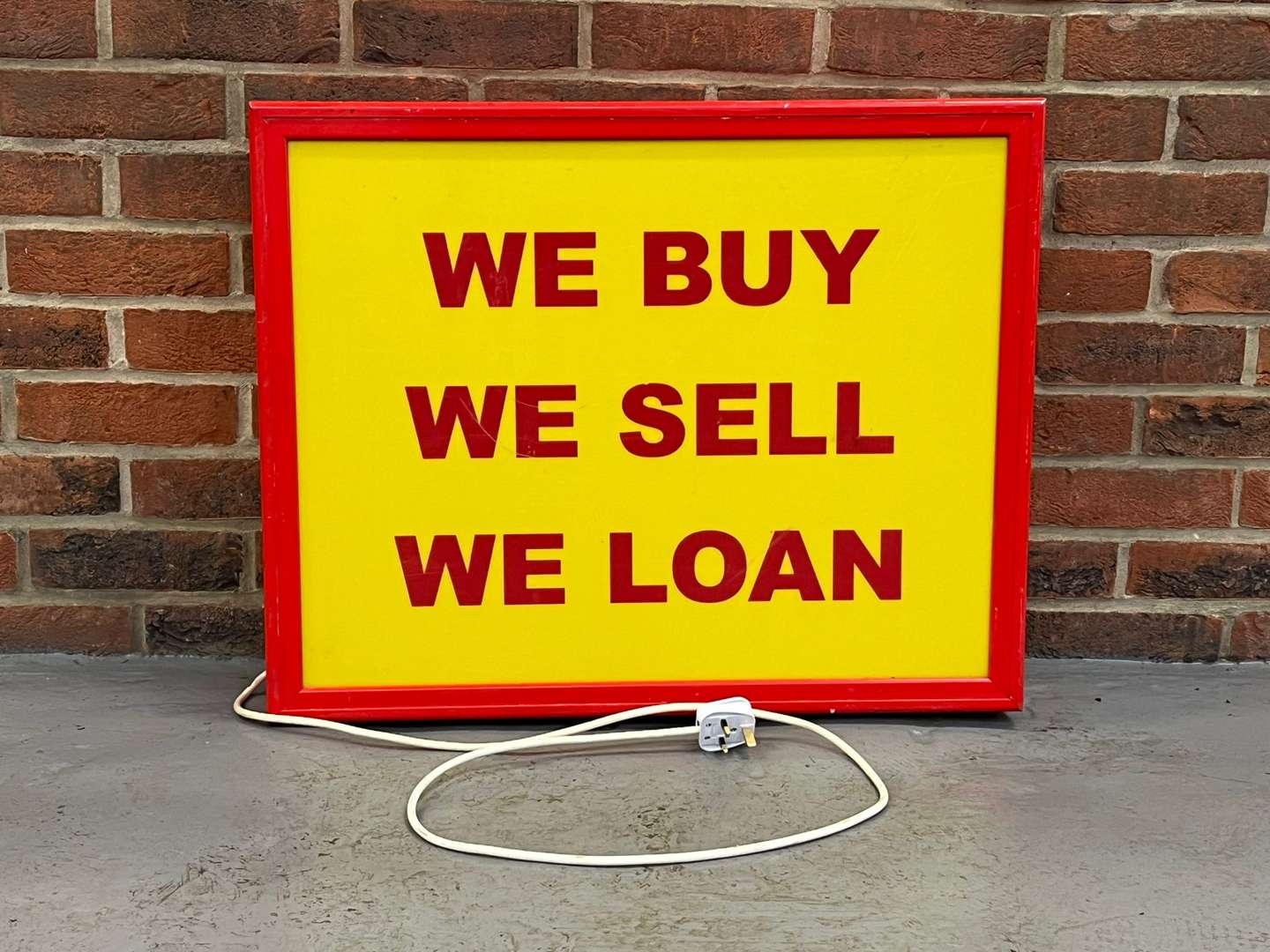 <p>We Buy, We Sell, We Loan Illuminated Sign</p>