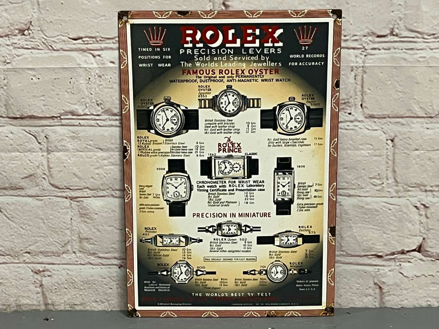 <p>Rolex Precisions Levers Enamel Sign</p>