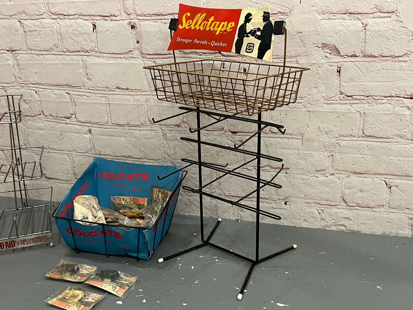 <p>Band Aid, Colgate and Sellotape Wirework Shop Display Stands (3)</p>