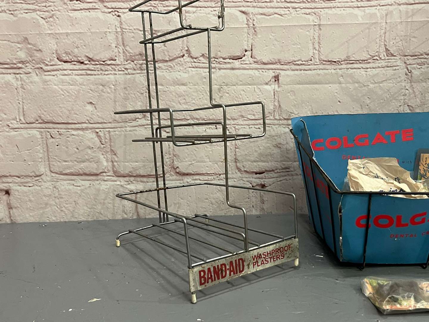 <p>Band Aid, Colgate and Sellotape Wirework Shop Display Stands (3)</p>