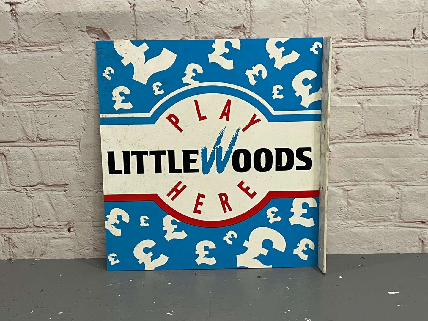 <p>Play Littlewoods Here Plastic Flange Sign</p>