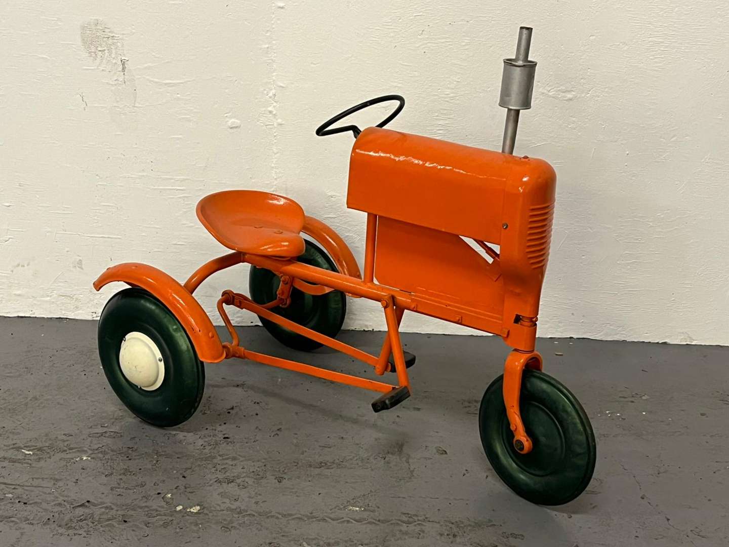<p>Tri-ang Tin Plated Pedal Tractor</p>