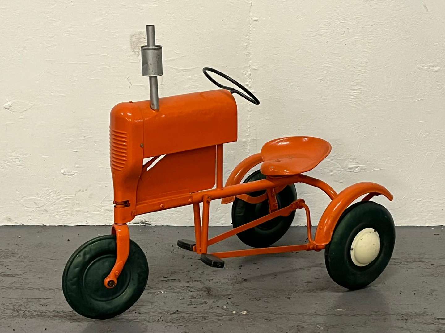 <p>Tri-ang Tin Plated Pedal Tractor</p>