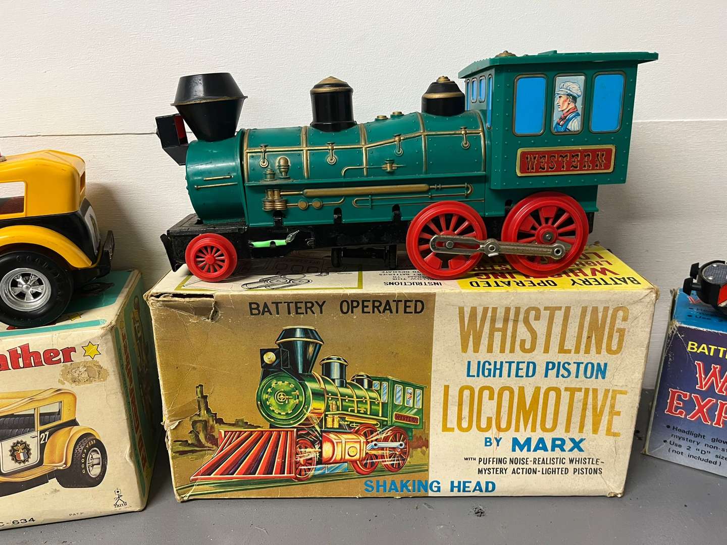 <p>Four Toy Trains and Car, Three in Original Boxes</p>