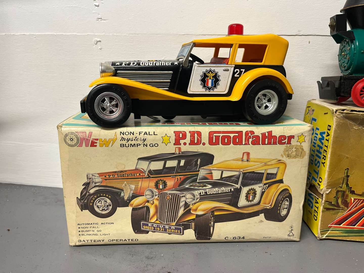 <p>Four Toy Trains and Car, Three in Original Boxes</p>