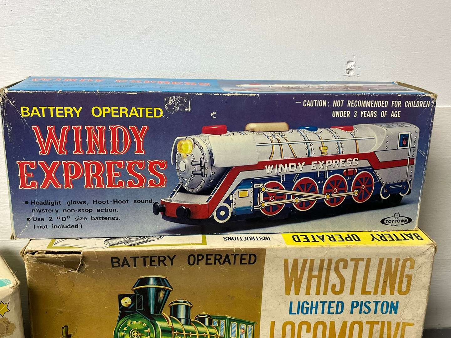 <p>Four Toy Trains and Car, Three in Original Boxes</p>