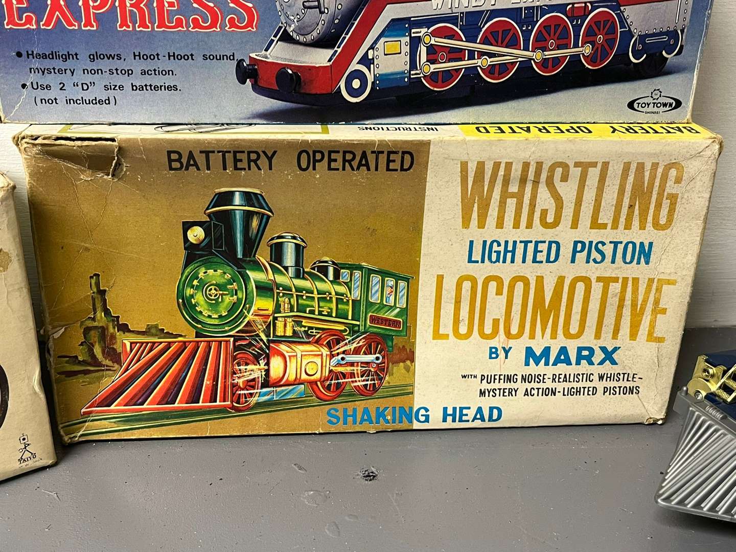 <p>Four Toy Trains and Car, Three in Original Boxes</p>