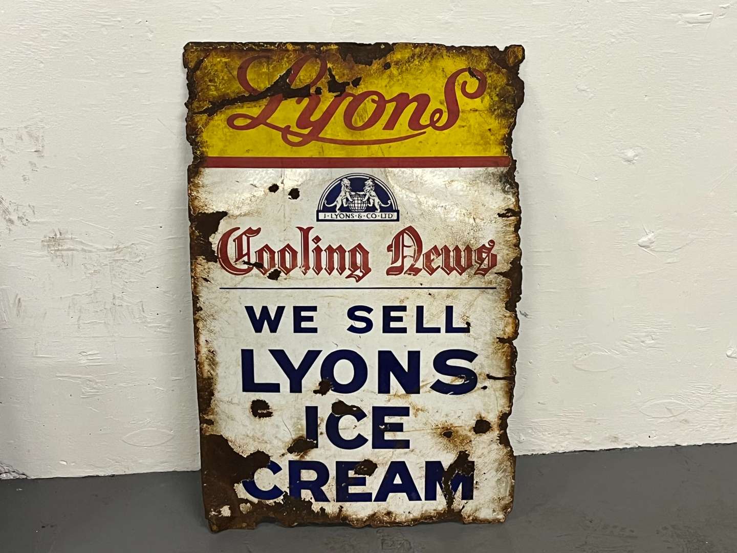 <p>Lyons Cooling News and Ice Cream Enamel Sign</p>