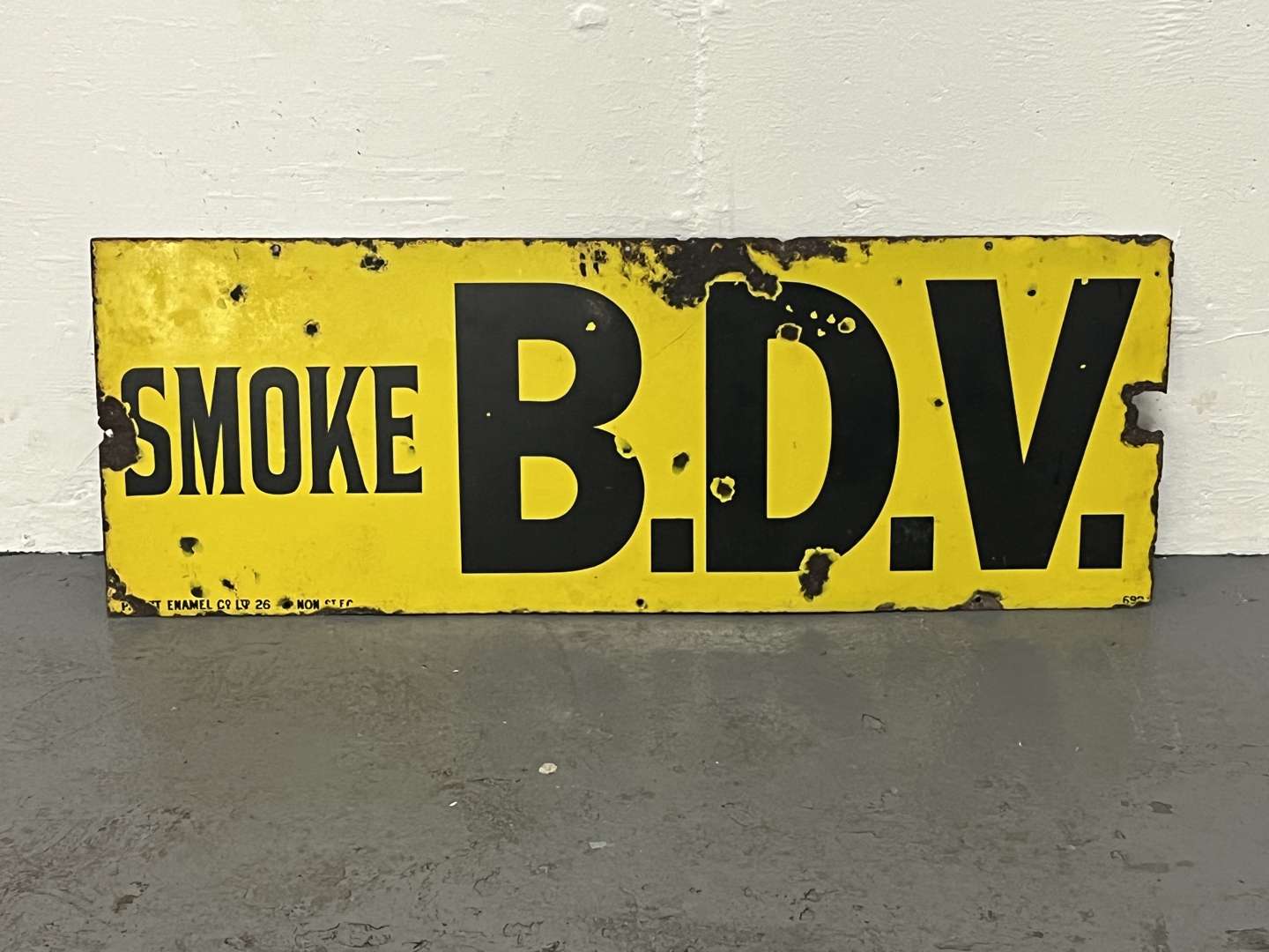 <p>Smoke B.D.V Enamel Sign</p>