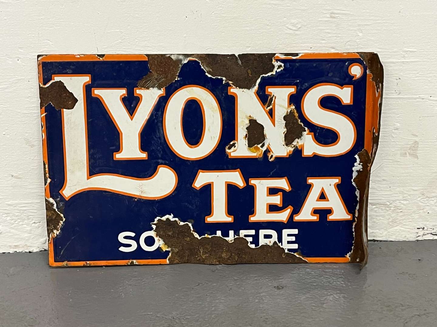 <p>Lyons Tea Sold Here Enamel Flange Sign</p>