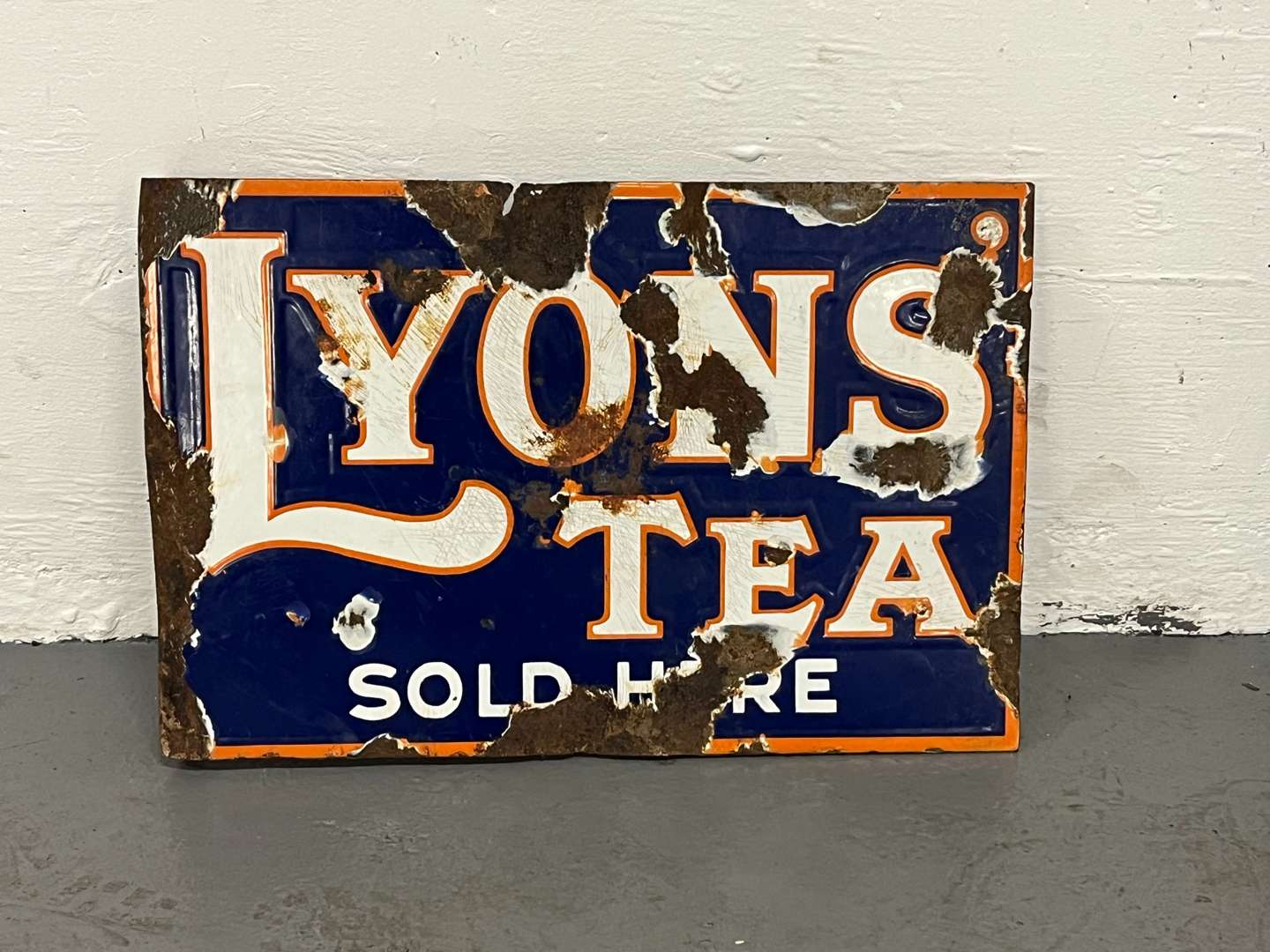 <p>Lyons Tea Sold Here Enamel Flange Sign</p>