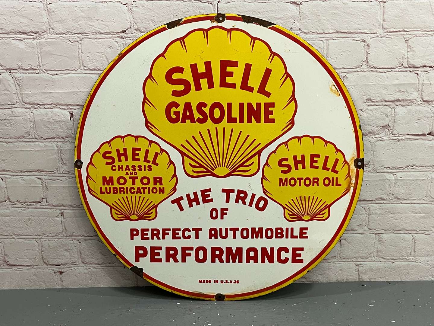 <p>Shell “The Trio of Perfect Automobile Performance” Circular Enamel Sign</p>