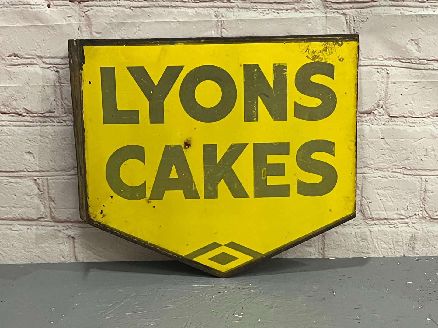 <p>Lyon Cakes Enamel Flange Sign</p>