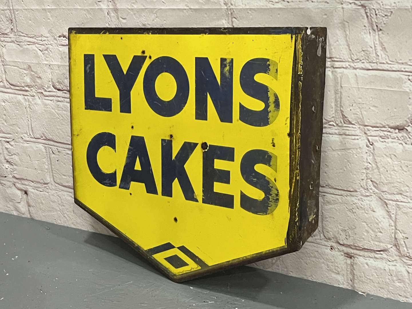 <p>Lyon Cakes Enamel Flange Sign</p>