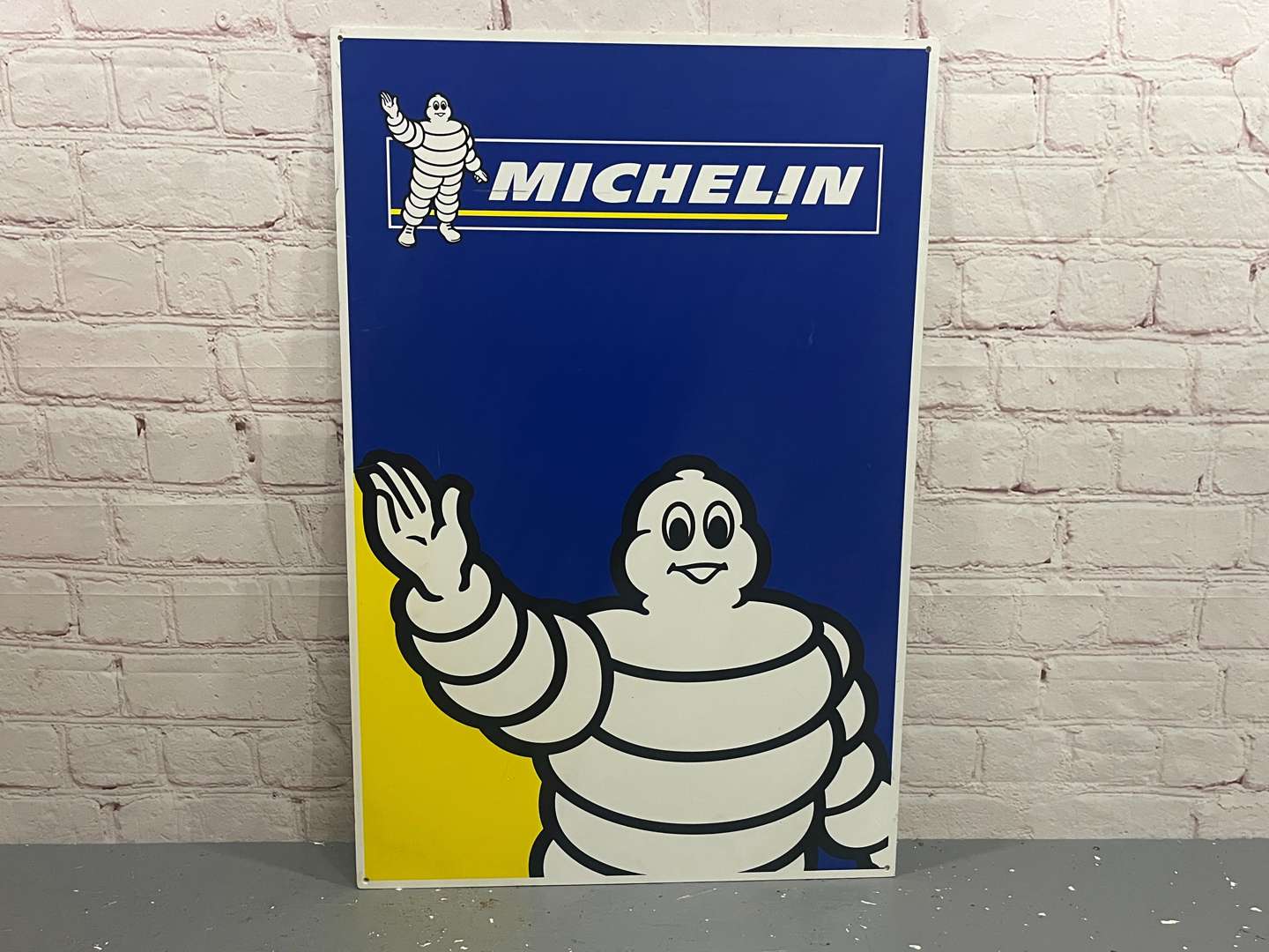 <p>Michelin Waving Sign on Plastic Board</p>