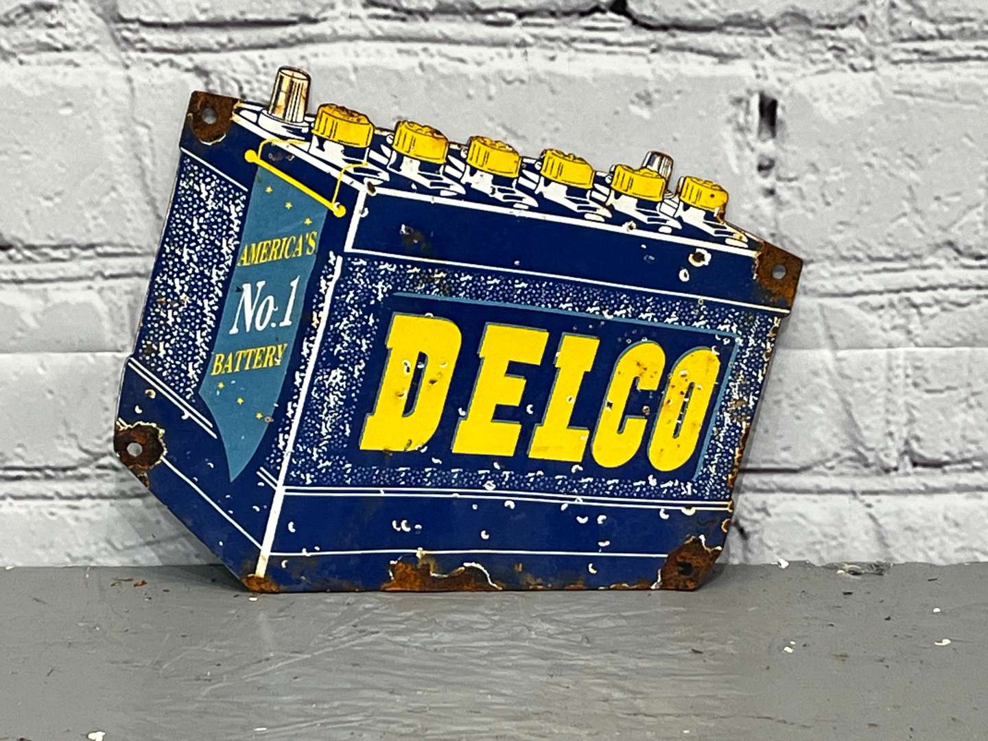 <p>Delco Batteries Small Enamel Sign</p>