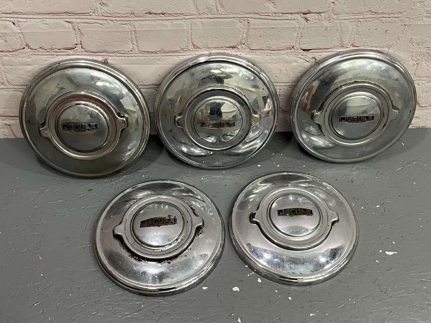 <p>Five Jaguar XK120 Hub Caps</p>