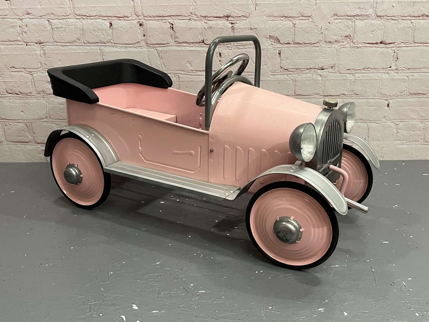 <p>Pink Childs Tin Plate Pedal Car</p>