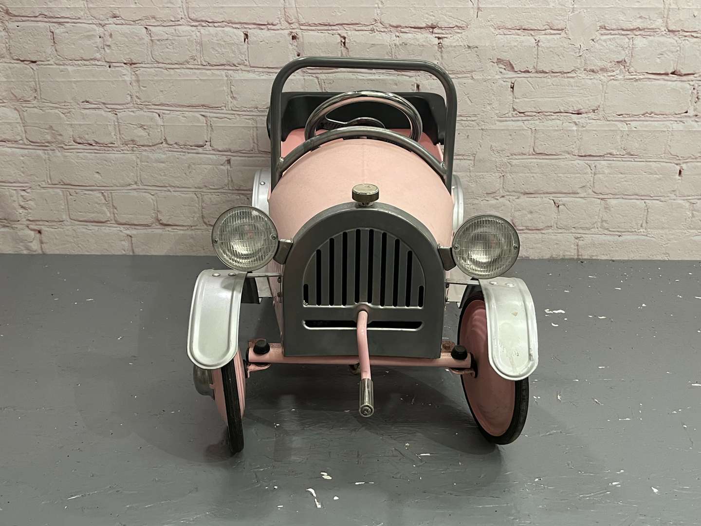 <p>Pink Childs Tin Plate Pedal Car</p>