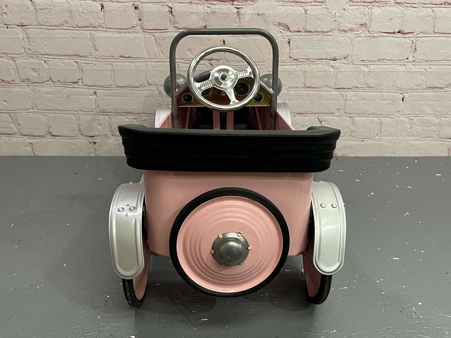<p>Pink Childs Tin Plate Pedal Car</p>