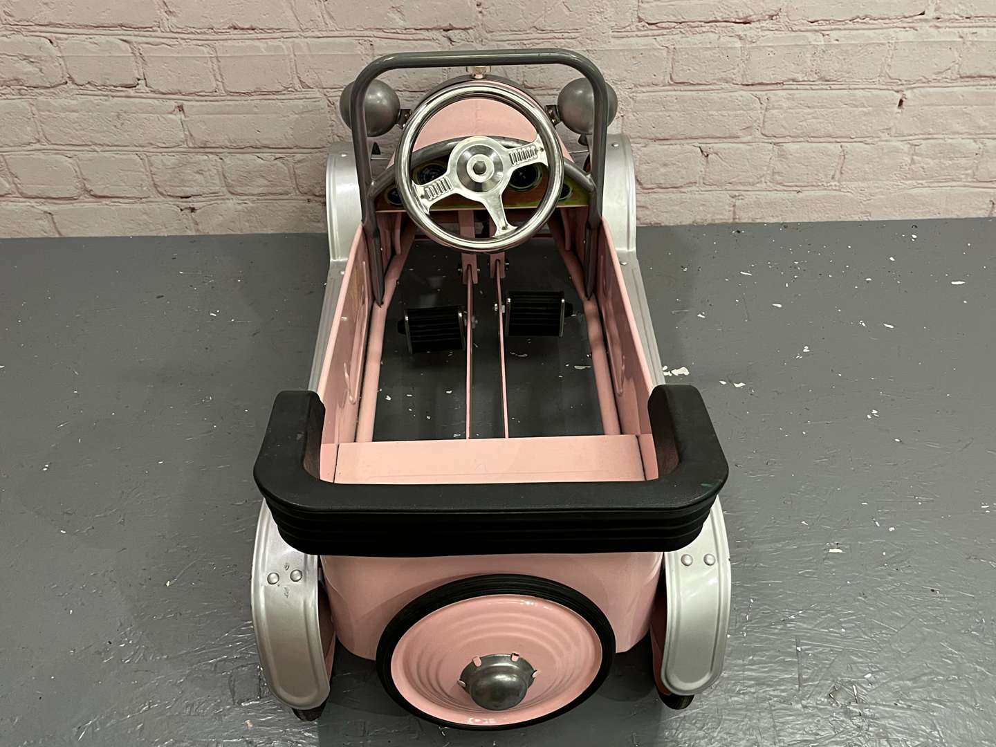 <p>Pink Childs Tin Plate Pedal Car</p>