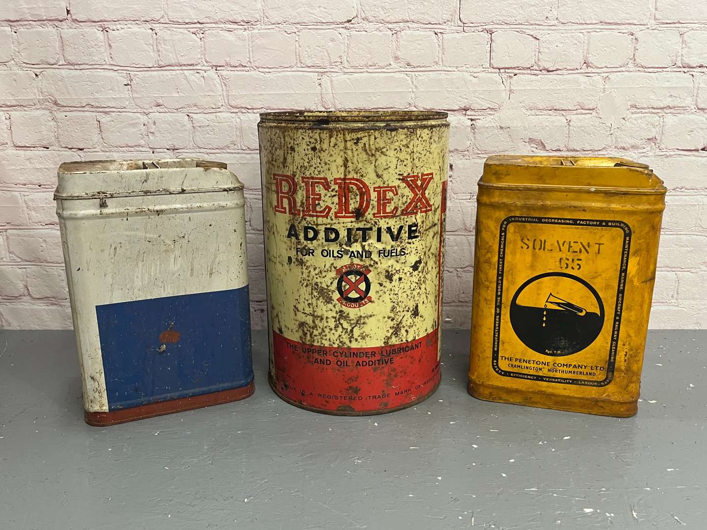 <p>Three Oil Cans</p>