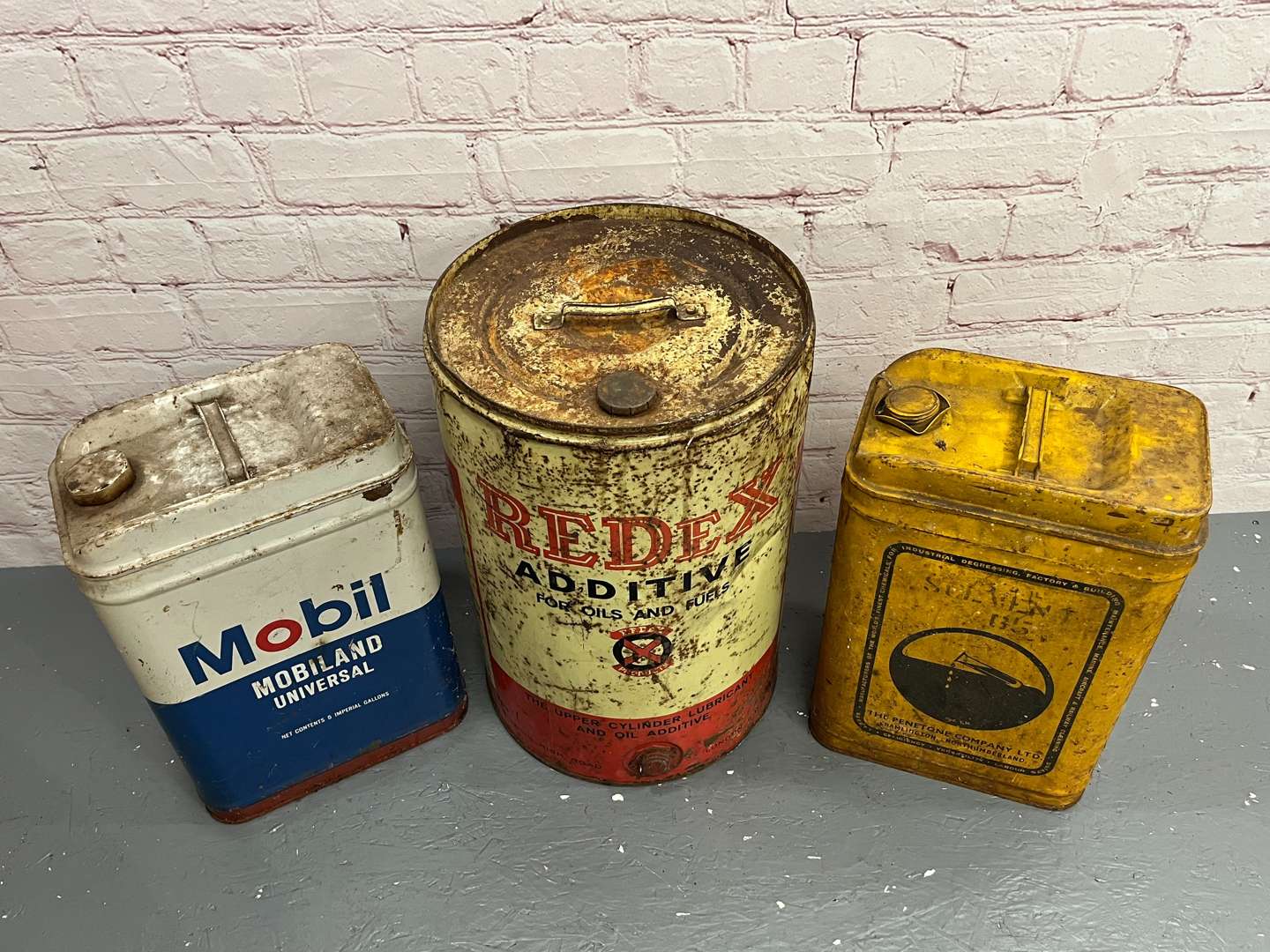<p>Three Oil Cans</p>
