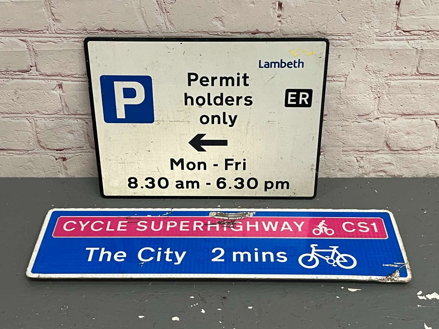 <p>Two Road Signs, Permit Holders & Cycle Route</p>