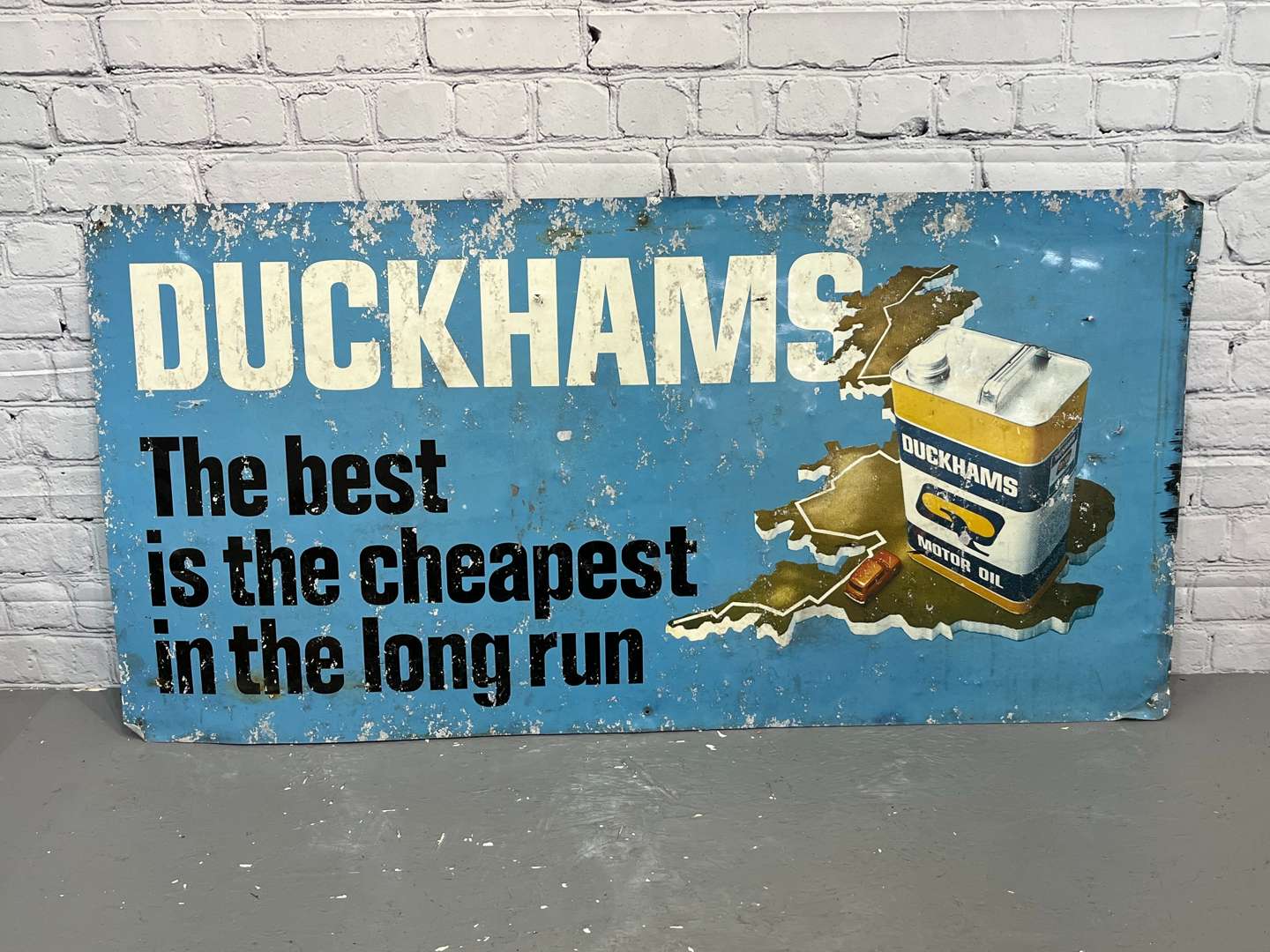 <p>Duckhams “The Best is The Cheapest In The Long Run” Aluminium Sign</p>