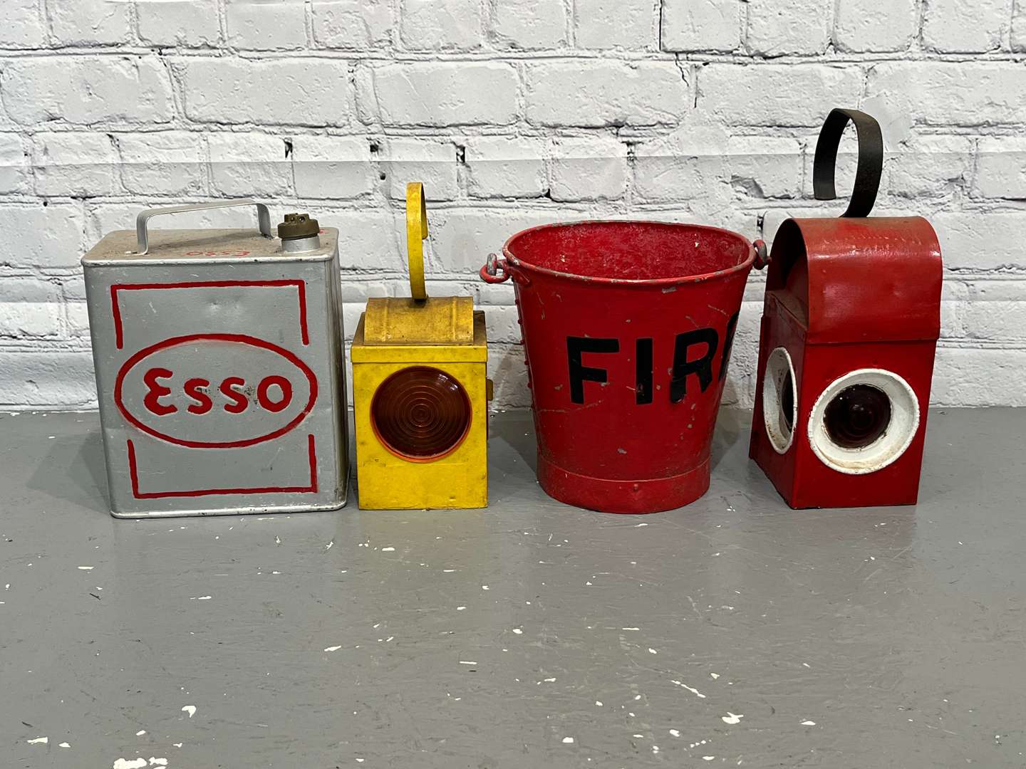 <p>Two Road Work Lamps, Esso Two Gallon Fuel Can & Fire Bucket (4)</p>
