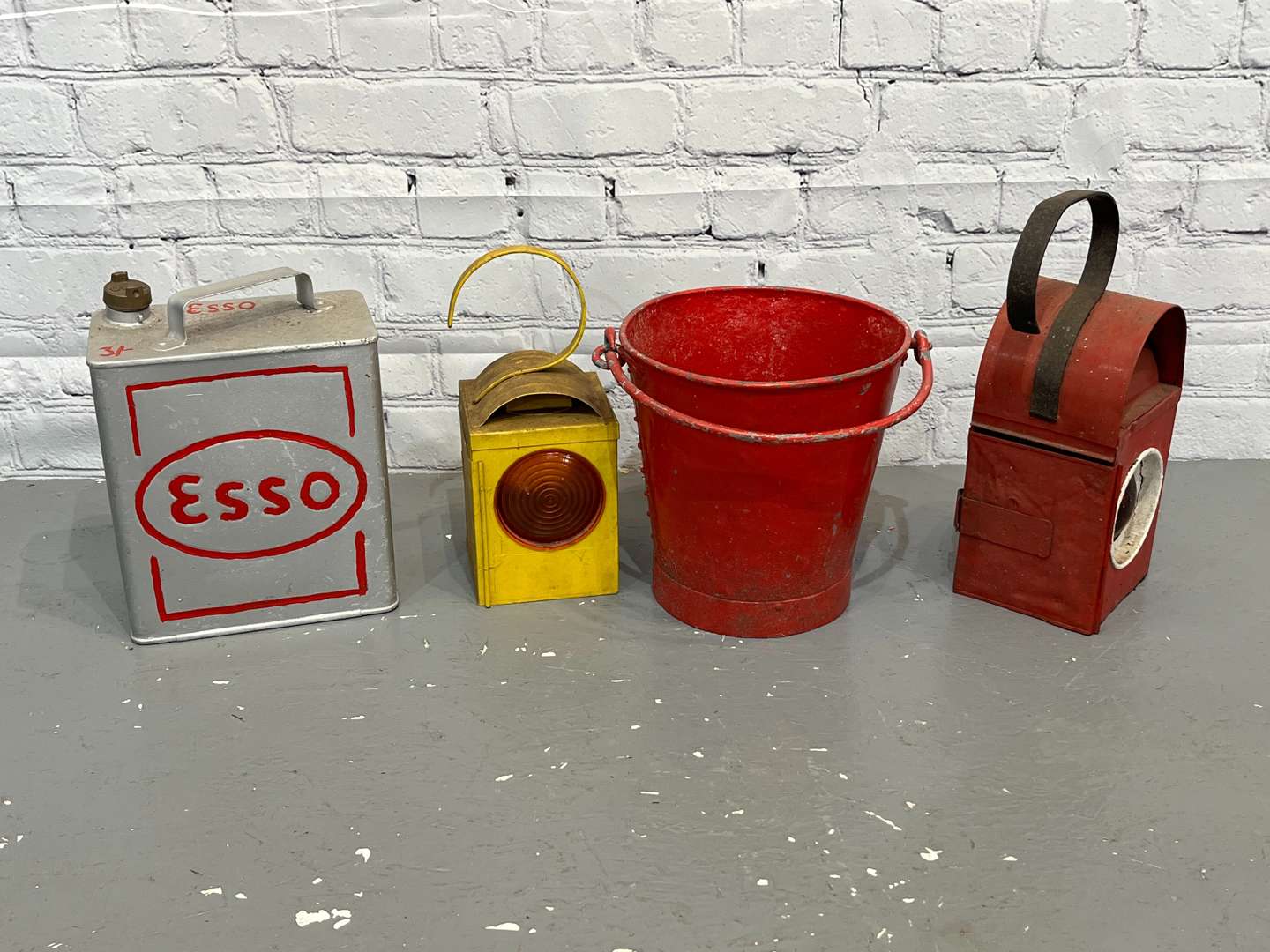 <p>Two Road Work Lamps, Esso Two Gallon Fuel Can & Fire Bucket (4)</p>