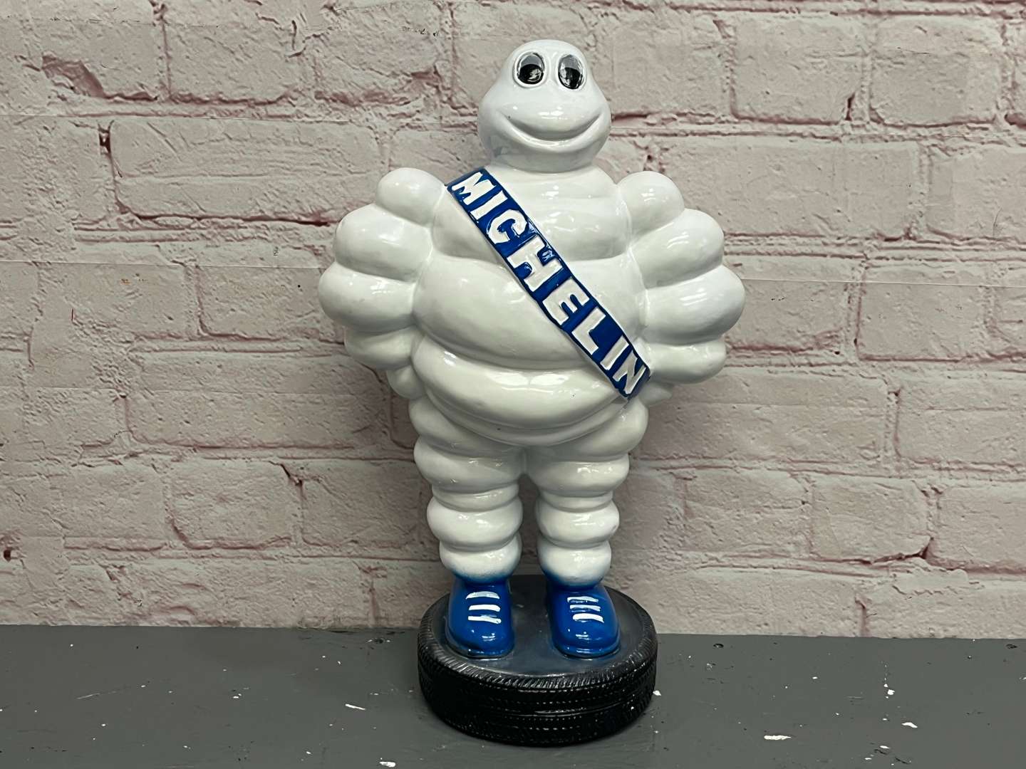 <p>Michelin Man Standing on a Tyre Display</p>