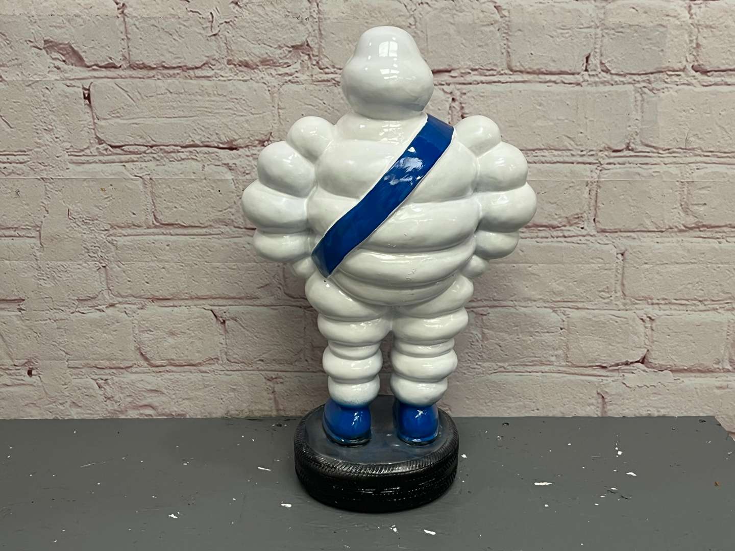 <p>Michelin Man Standing on a Tyre Display</p>