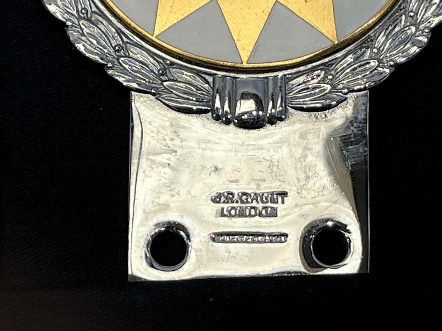 <p>JR Gaunt Rare Multicolour Twelve Point Star Car Badge Boxed</p>