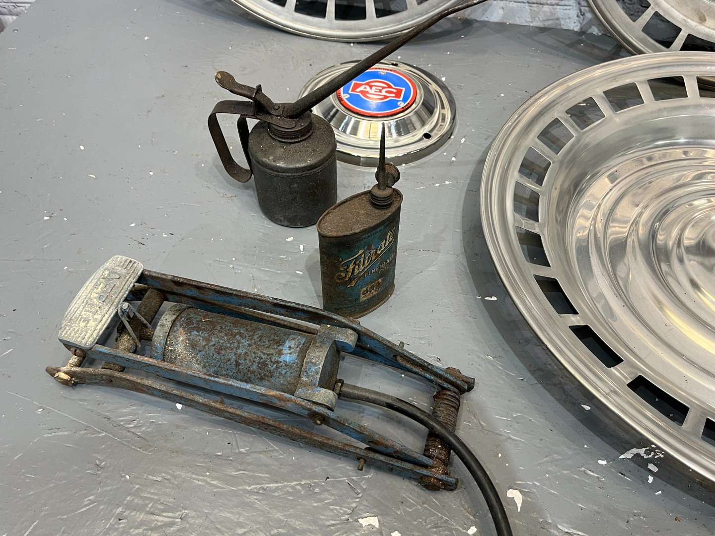 <p>AEC Badges, Four Commercial Hub Caps, Oil cans Etc</p>