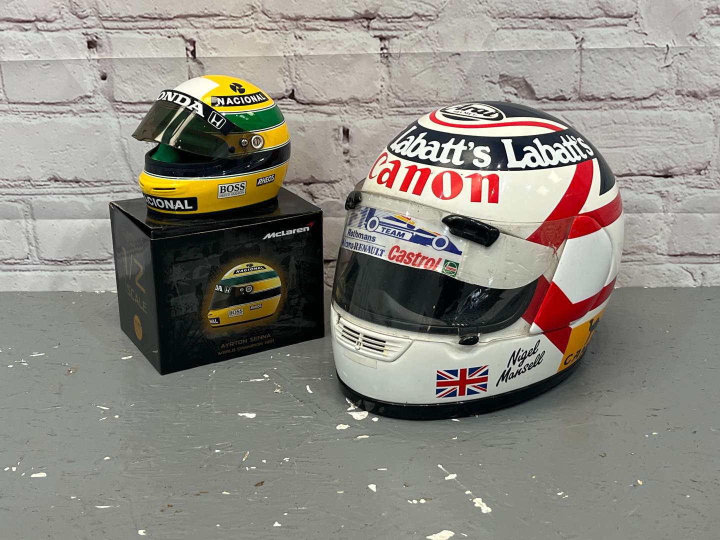 <p>Nigel Mansell & Miniature Ayrton Senna Display Helmets</p>