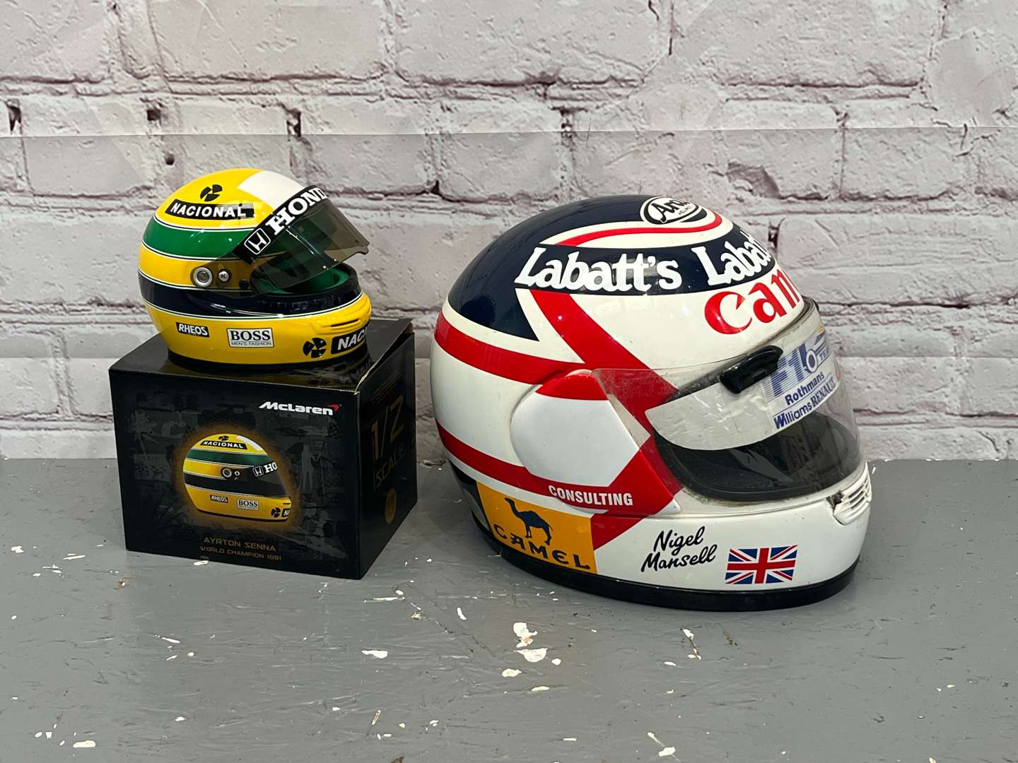 <p>Nigel Mansell & Miniature Ayrton Senna Display Helmets</p>