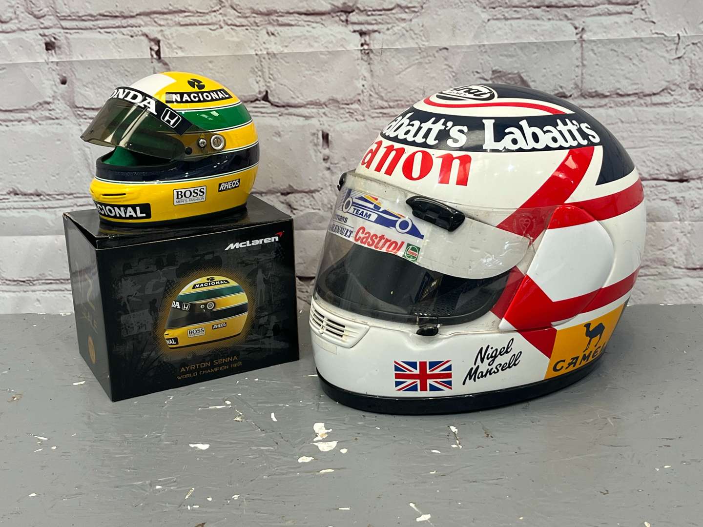<p>Nigel Mansell & Miniature Ayrton Senna Display Helmets</p>