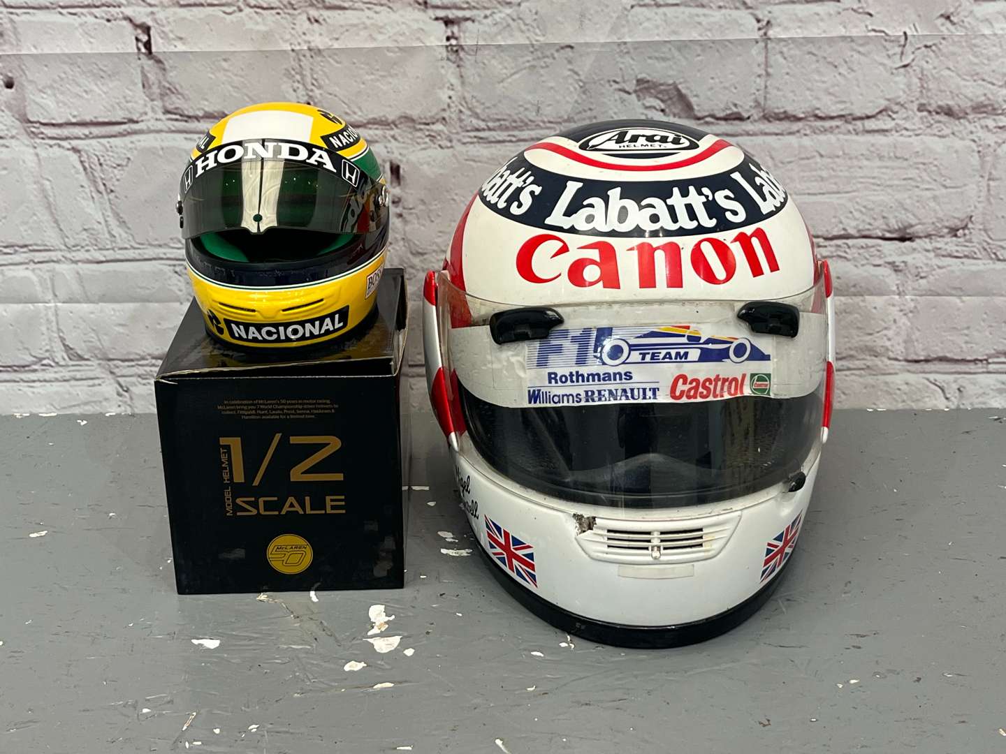 <p>Nigel Mansell & Miniature Ayrton Senna Display Helmets</p>
