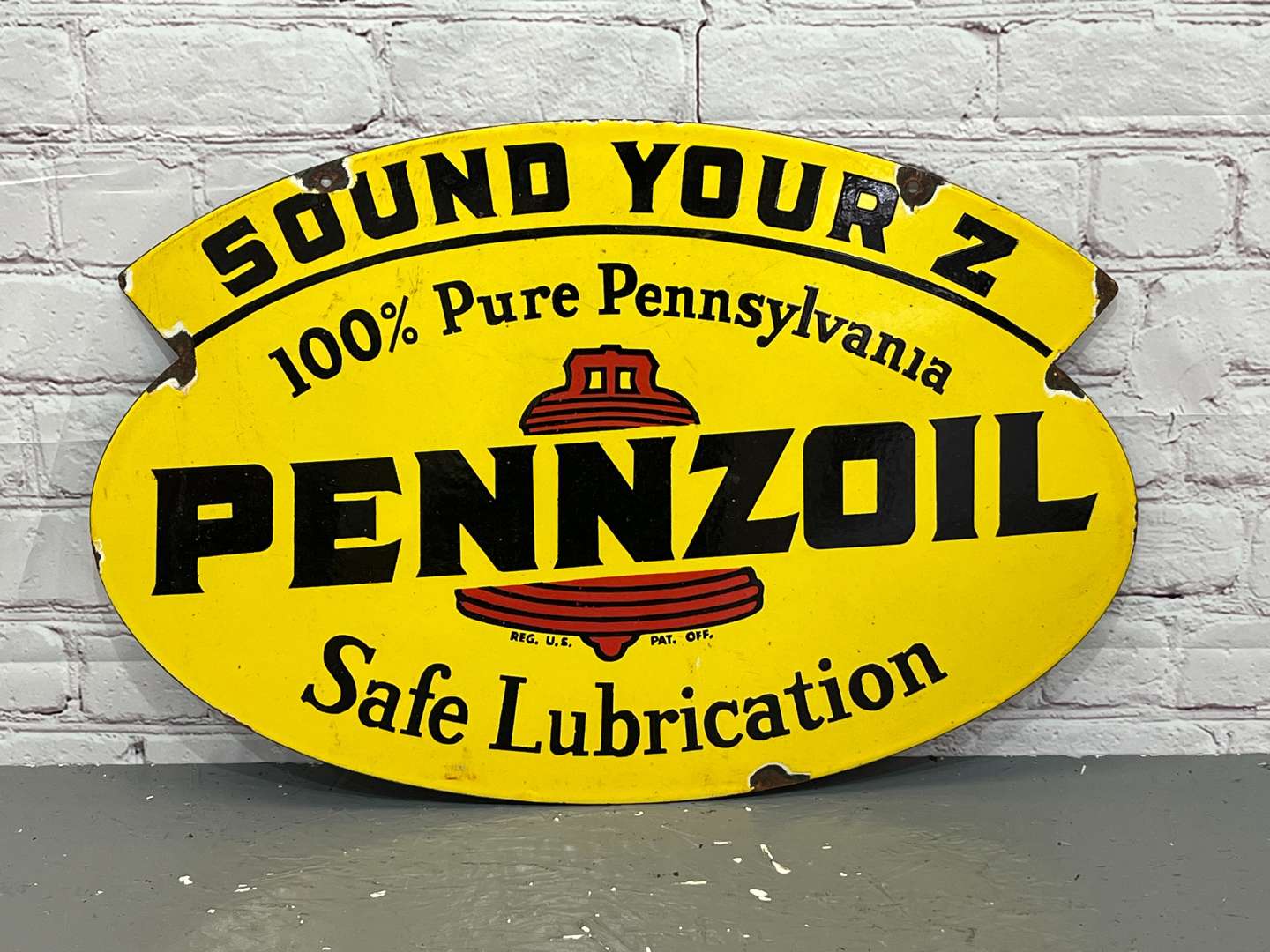 <p>Pennzoil Safe Lubrication Enamel Sign</p>