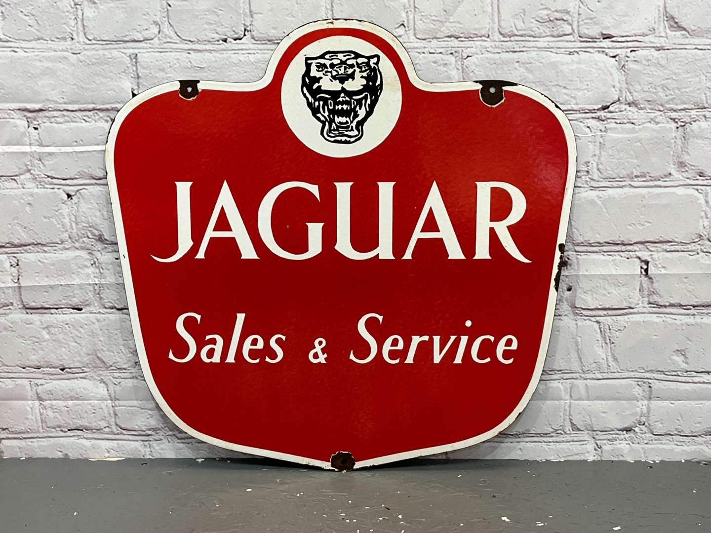 <p>Jaguar Sales & Service Enamel Sign</p>