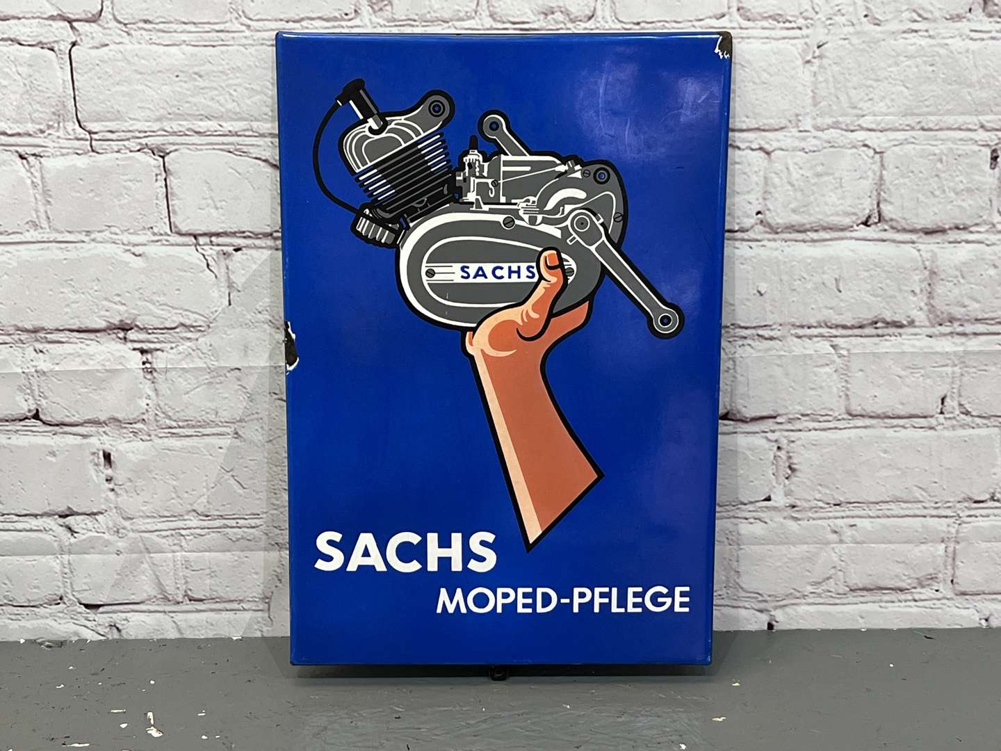 <p>Sachs Moped - Pflege Enamel Sign</p>