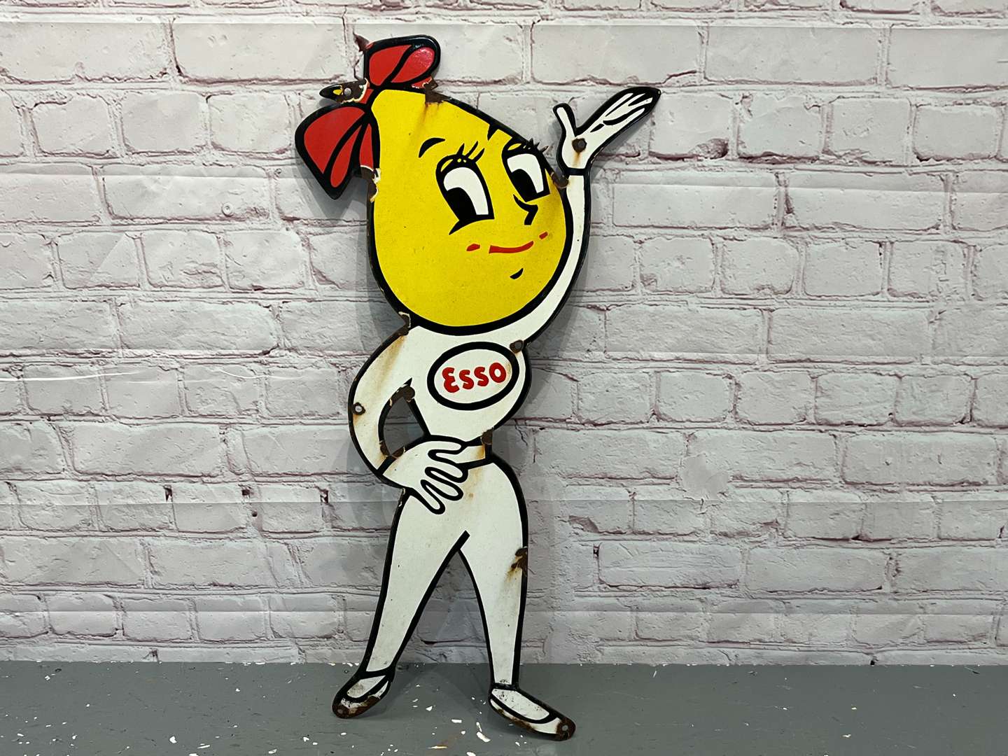 <p>Esso Mrs Drip Enamel Sign</p>